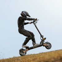 Circooter Cruiser Pro 2400W dual-motor off-road electric scooter with 11-inch pneumatic off-road tires, dual hydraulic suspension front and rear, hydraulic disc brakes, extra-wide deck, UL 2272 certified electrical system, and a 38 mph top-speed claim