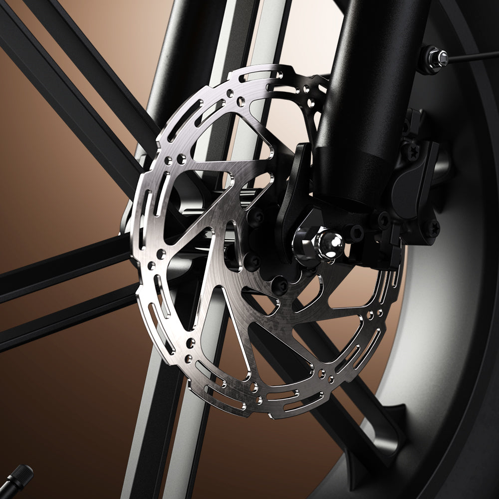 Front hydraulic disc brake rotor and caliper in close detail