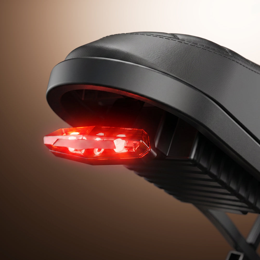 Rear LED brake light glowing beneath the CycHunter 2.0 saddle