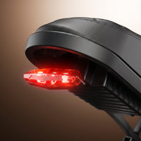Rear LED brake light glowing beneath the CycHunter 2.0 saddle