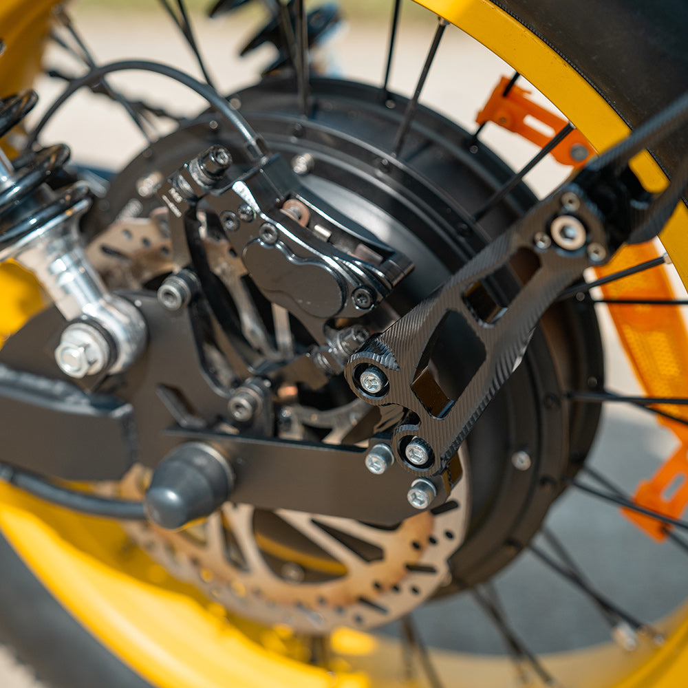 Detail view of the HappyRun G100 Pro round caged LED headlight with the 160-lumen output facing forward