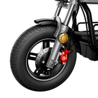 Close view of the iScooter DX5Pro front wheel, fork, gold suspension hardware, red brake caliper, and wide road tire.