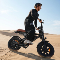 Rider taking the Run Mini across sandy terrain
