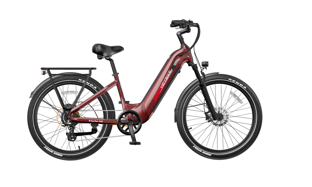 Heybike Hybrid Class 2/3 electric commuter bike with 750W rated rear-hub motor, 27.5 by 2.4 inch KENDA tires, Tektro hydraulic disc brakes, Shimano Altus 8-speed gearing, 6061 aluminum frame, hydraulic front fork, integrated turn-signal lighting, and an 864Wh battery on a UL 2849 certified electrical system