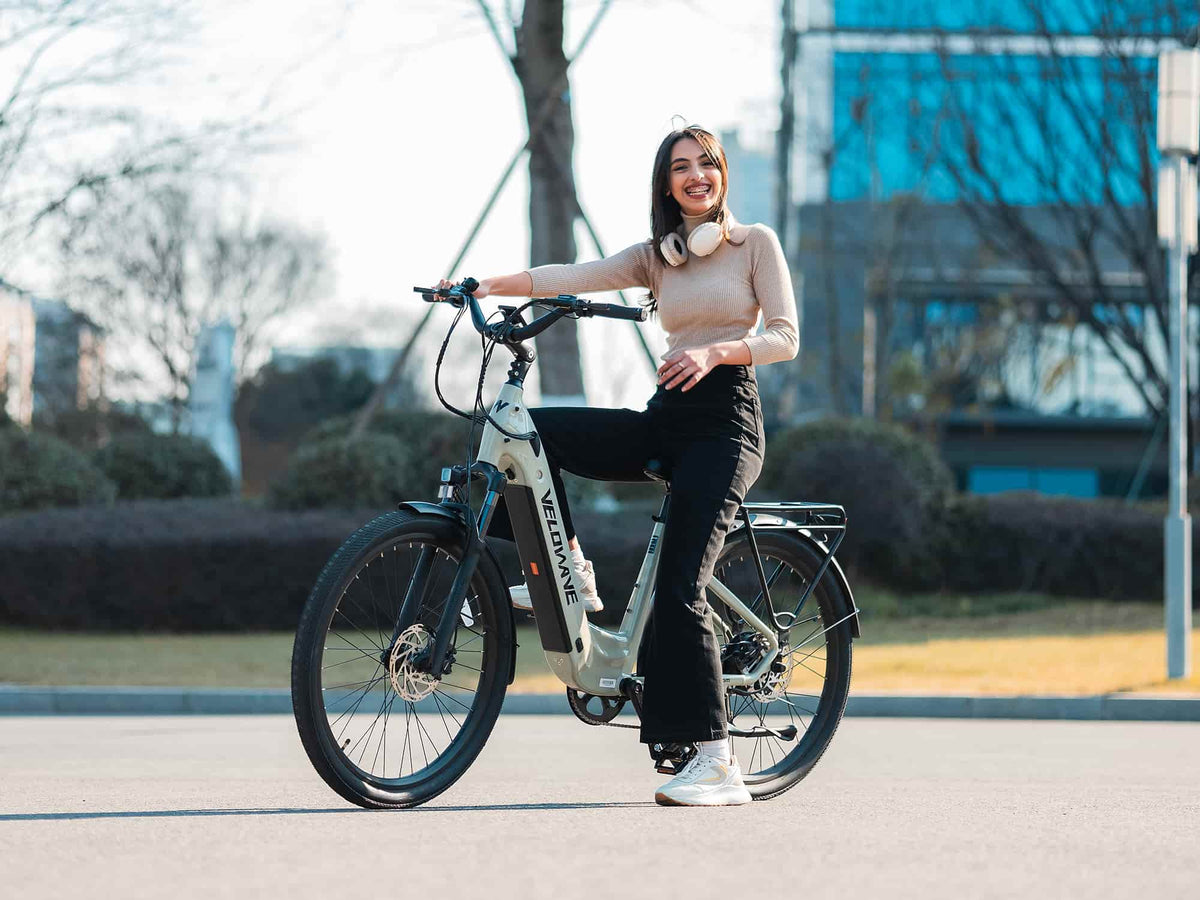 Rider standing beside a Light Green Velowave Breeze T on an urban street