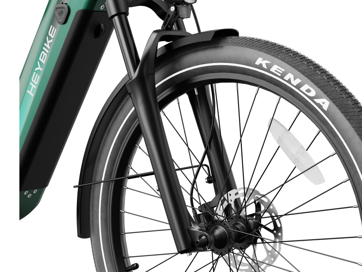 Heybike Hybrid Class 2/3 electric commuter bike with 750W rated rear-hub motor, 27.5 by 2.4 inch KENDA tires, Tektro hydraulic disc brakes, Shimano Altus 8-speed gearing, 6061 aluminum frame, hydraulic front fork, integrated turn-signal lighting, and an 864Wh battery on a UL 2849 certified electrical system