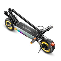 Folded isinwheel GT4 showing the deck, stem latch, suspension, and 12-inch tires