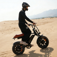 Helmeted rider crossing a sandy landscape on the Run Mini