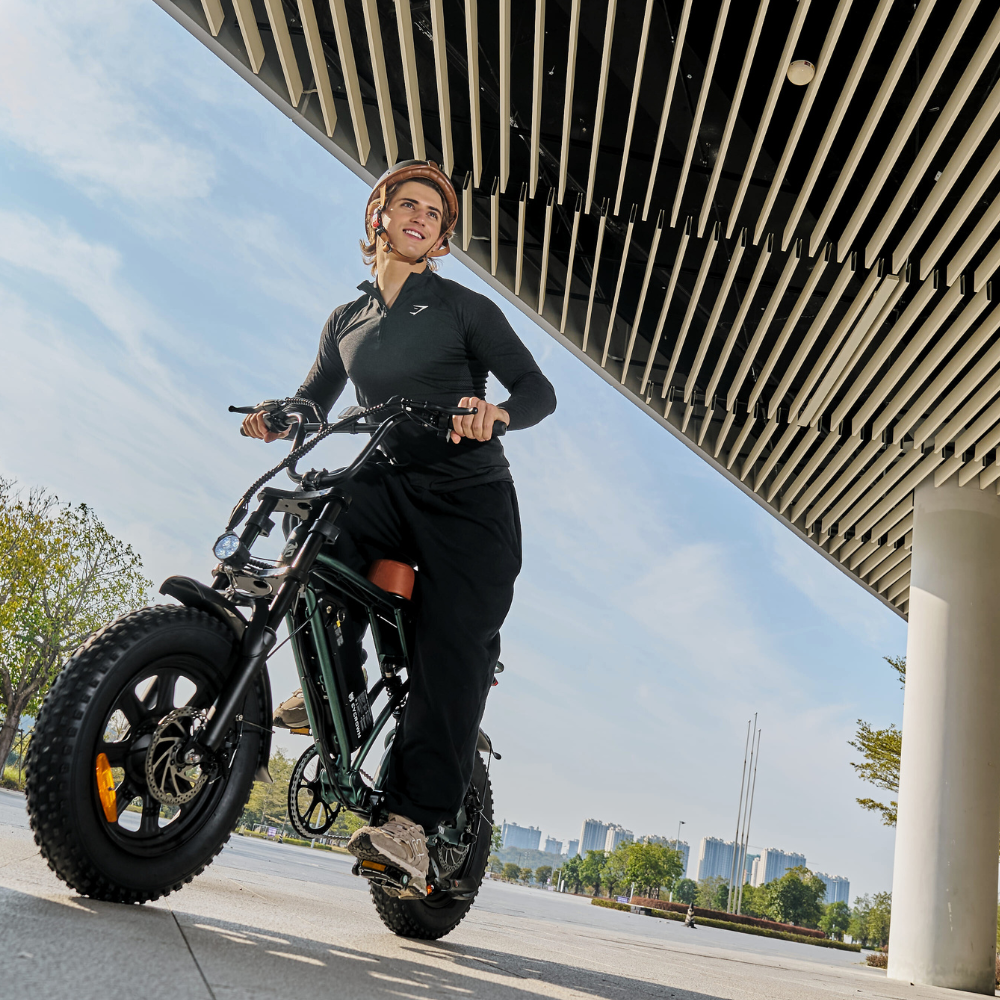 Rider traveling beneath an elevated city structure on the Run Mini