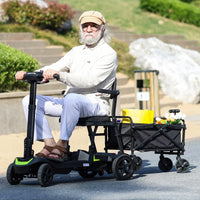 Adult riding ScootNGo Lite mobility scooter beside a cargo wagon on pavement