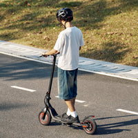 iScooter i9M sub-budget folding commuter electric scooter: 42V peak 500W brushless front-wheel-drive motor, 22 mph, 315Wh battery, 10-inch pneumatic tires, EBAS plus rear disc brake, IP54, Tuya app integration, included mudguards, 28.9 lb folded