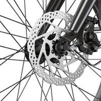 Close-up of the isinwheel U7 front disc brake rotor and caliper assembly with the spoked 20-inch fat-tire wheel