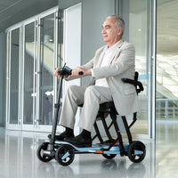 Older adult riding a ScootNGo Voyager mobility scooter indoors