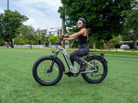 Rider on a Morandi Green Velowave Ranger Step-Thru 2.0 from the rear angle