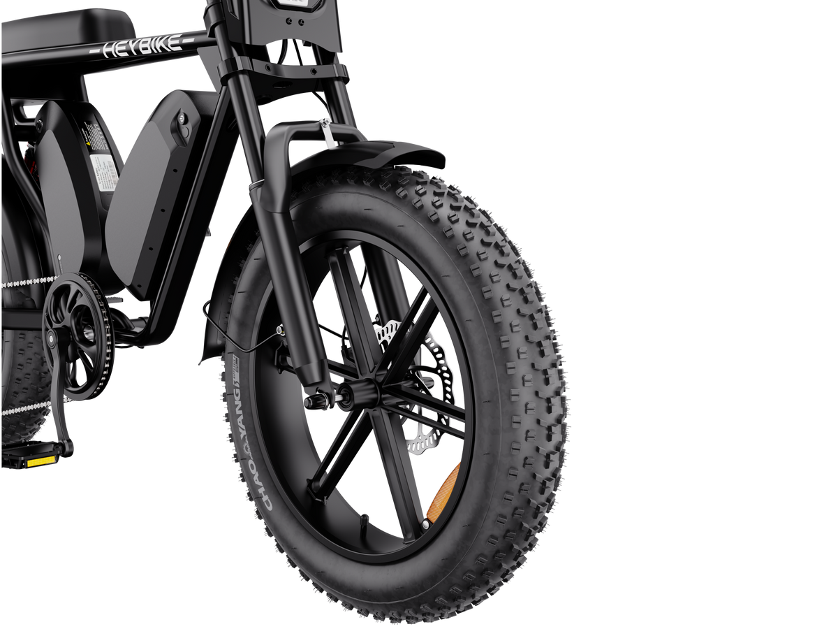 Heybike Saturn moped-style commuter e-bike: 52V 1000W continuous / 1800W peak hub motor, 95 Nm torque, single or dual-battery configuration, hydraulic disc brakes, full suspension with 140 mm front travel, turn signals, TFT color display, UL 2849 certified