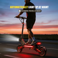 Freeboy J15 MAX rider with headlight and rear light at dusk