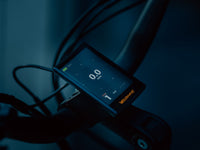 Velowave Breeze T handlebar display illuminated in low light