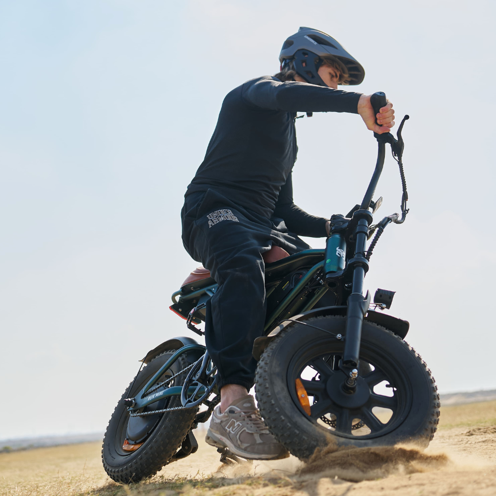Rider leaning the Run Mini into a turn on dirt