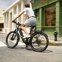 Rider using a black Dremax on a quiet neighborhood street with a relaxed upright posture.
