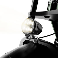 Run Mini headlight switched on above the front fender
