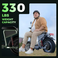 Adult rider seated on the H7Pro beside the published 330 lb maximum load graphic