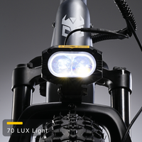 Nomad Pro 70 lux front headlight illuminated above the fat front tire.