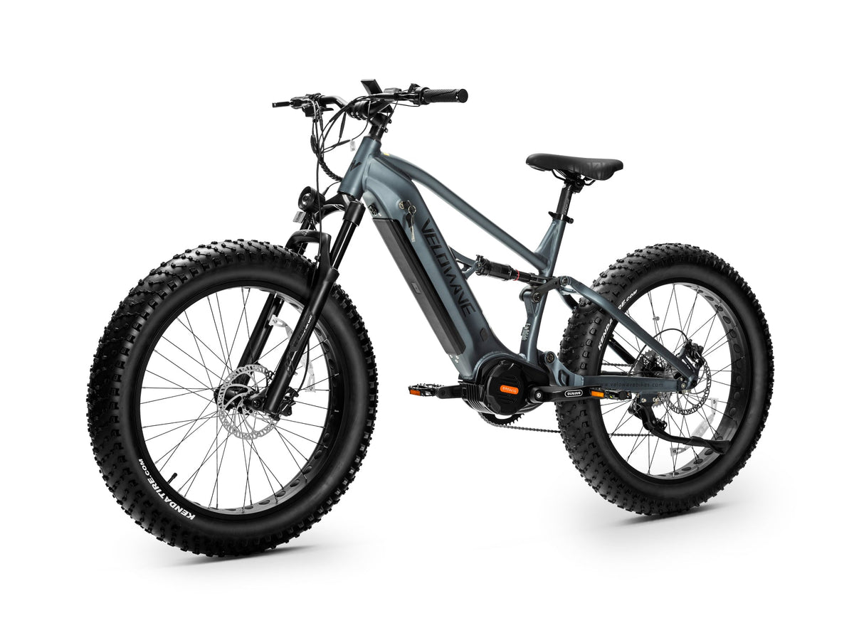 Dark Blue Brawny XM rear three-quarter studio view showing rear shock, cassette and derailleur