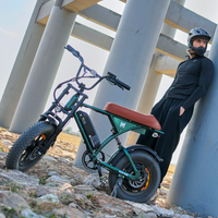 Helmeted rider beside a green Run Mini near concrete columns