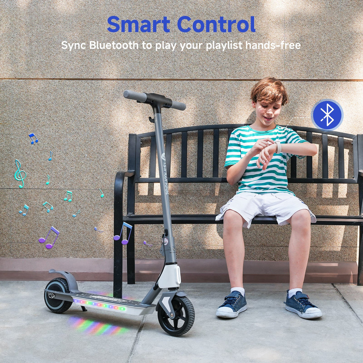 Child using Bluetooth audio beside an illuminated isinwheel S4 scooter