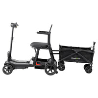 ScootNGo Lite black mobility scooter with red accents attached to cargo wagon