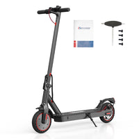 iScooter i9 standing beside included charger, manual, screws, handlebar cap, and setup tool.
