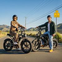 Two CycHunter owners stopped together on a clear mountain road