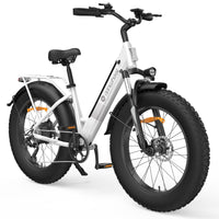 Front three-quarter view of the Lunar White isinwheel M60 showing the dual-LED front headlights mounted on the suspension fork, the color LCD display, the front fat tire, and the step-through frame