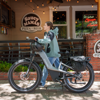 Loaded Nomad Pro parked outside a roadside restaurant with cargo mounted for a casual day ride.