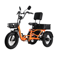 Orange Meet One Breeze Pro 2.0 rear three-quarter studio view with rear basket, wide rear stance, fat tires, and upright handlebar.