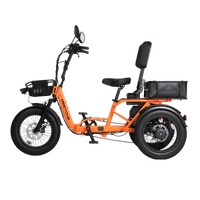 Orange Meet One Breeze Pro 2.0 side profile showing the folding step-thru frame, front basket, rear basket, backrest, and three fat tires.