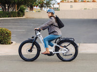 Heybike Alpha 500W mid-drive fat-tire all-terrain electric bike with a torque-plus-cadence sensor, Shimano Altus 8-speed drivetrain, hydraulic disc brakes, 26 by 4 inch fat tires, reinforced aluminum frame in step-through (Pearl White) or step-over (Galaxy Black) configuration, 680Wh battery, and UL 2849 certified electrical system