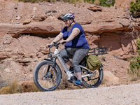Heybike Alpha 500W mid-drive fat-tire all-terrain electric bike with a torque-plus-cadence sensor, Shimano Altus 8-speed drivetrain, hydraulic disc brakes, 26 by 4 inch fat tires, reinforced aluminum frame in step-through (Pearl White) or step-over (Galaxy Black) configuration, 680Wh battery, and UL 2849 certified electrical system