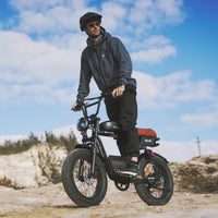 Side profile of the isinwheel R6 Pro showing the moped-shaped tank cover with R6 Pro graphics, the rear coil-over shock, and the kickstand on a plain studio background