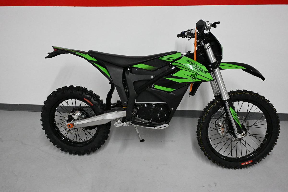 Trailblaze Motors Omega in green graphics, studio side view