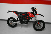 Trailblaze Motors Omega in red graphics, studio side view