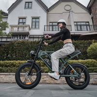 Rider traveling through a residential street on the mint green CycHunter