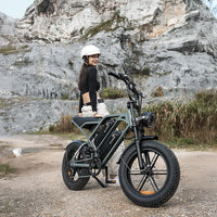 Mint green CycHunter parked on rocky ground with a helmeted rider