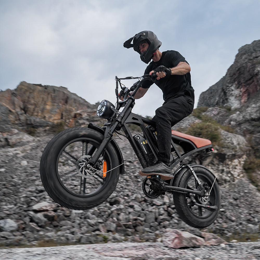 Rider climbing a rocky slope on the black CycHunter