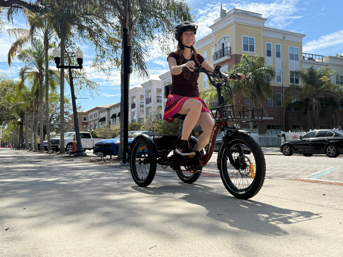 Helmeted rider on a Deep Crimson EUNORAU ONE-TRIKE 2.0