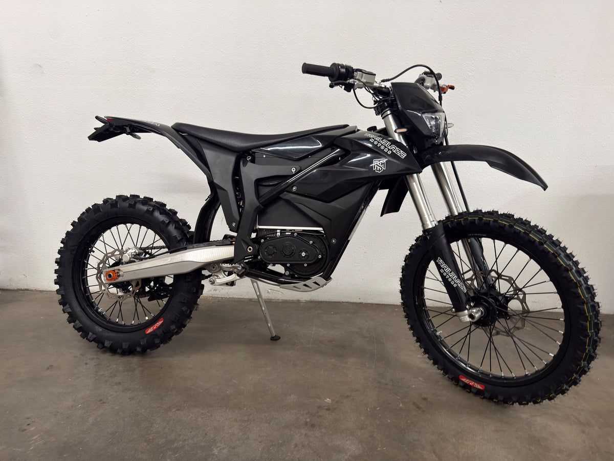 Trailblaze Motors Omega in black with 21-inch front and 18-inch rear tires