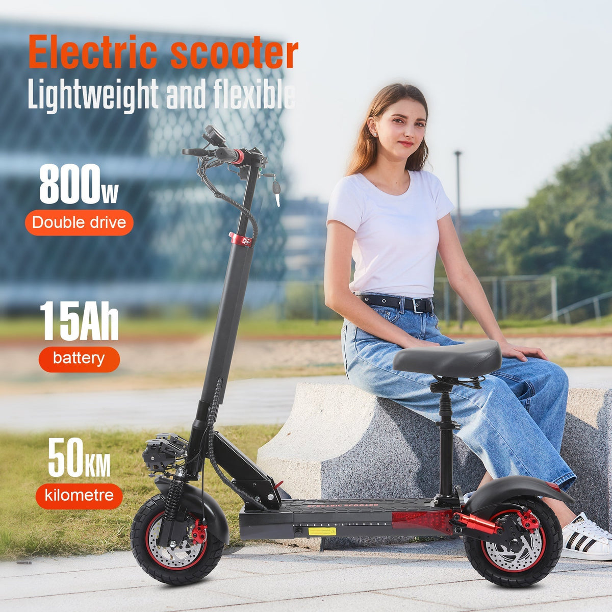Rider seated on a Freeboy J01 electric scooter outdoors