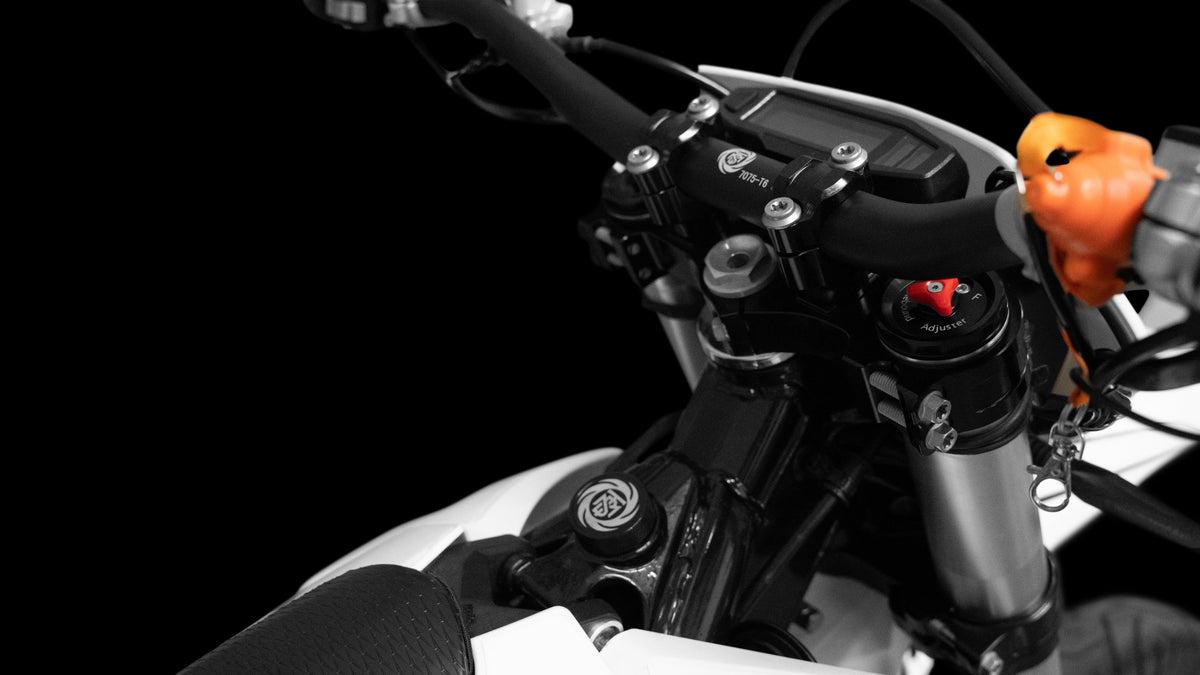 Trailblaze Motors Omega SM handlebar and fork-crown close-up