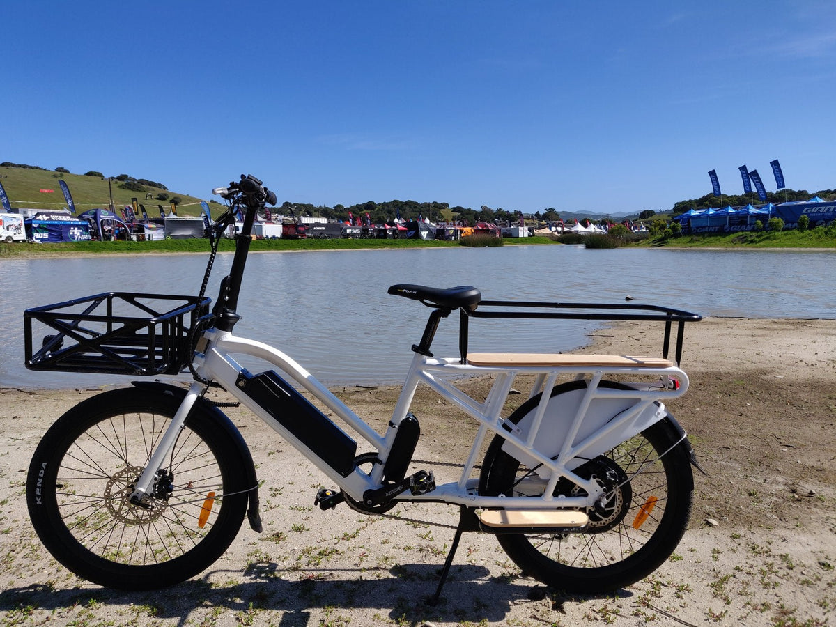 White EUNORAU MAX-CARGO cargo bike outdoors with front cargo basket