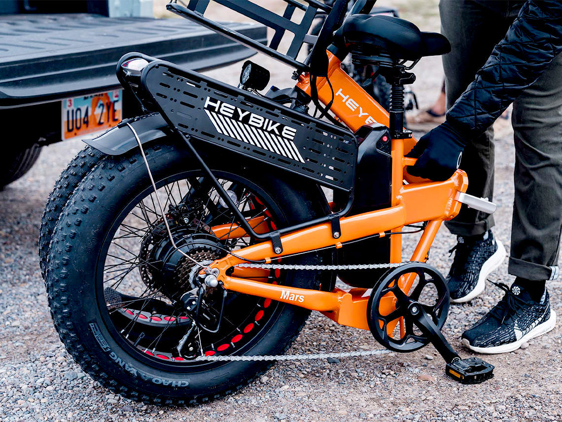 Heybike Mars 2.0 folding fat-tire commuter e-bike with 20 by 4 inch fat tires, 750W or 1000W rear hub motor, 600Wh removable battery, spring fork, 7-speed Shimano, rear rack, UL 2849 certified, four-color option matrix